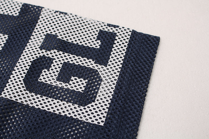 Close-up of navy mesh varsity jersey with large white No. 8 graphic on an oversized streetwear top