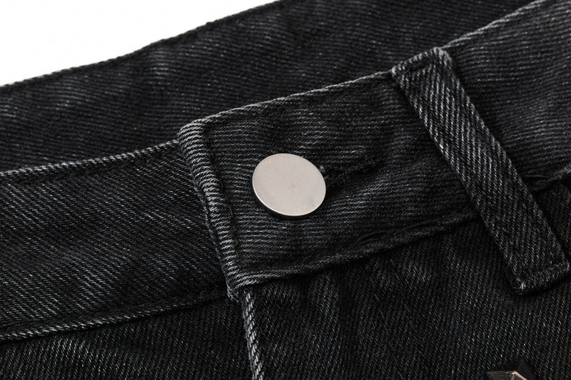 Close-up of jeans waistband button and black denim texture