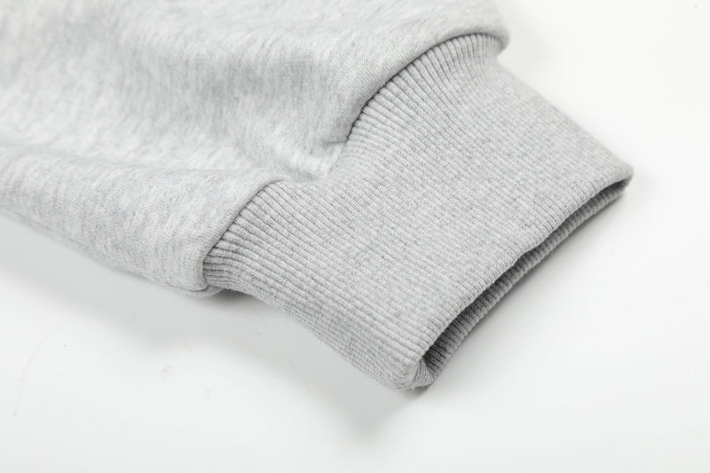Close-up of light gray hoodie ribbed sleeve cuff