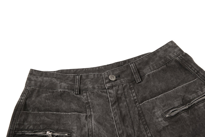 Dark charcoal denim waistband and front pocket close-up with zipper detail