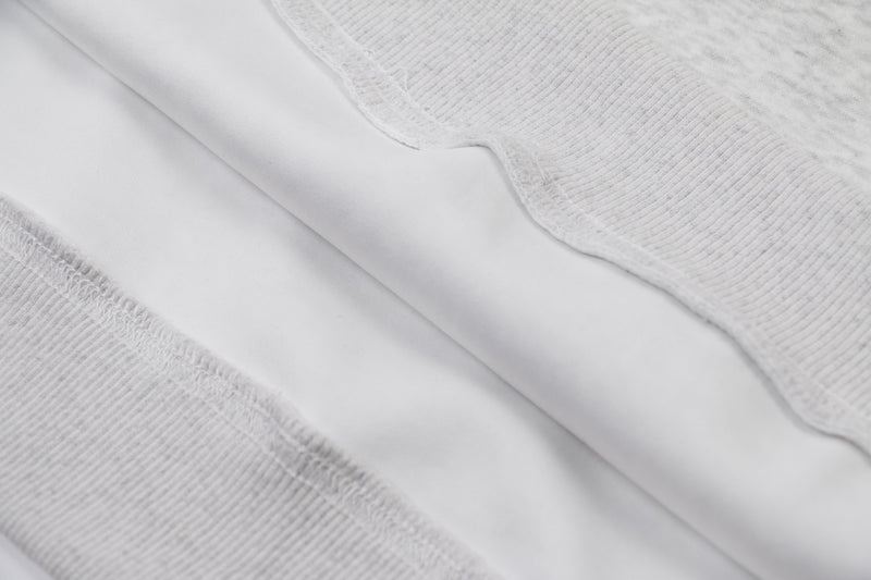 Close-up of gray hoodie inner seam and fleece lining