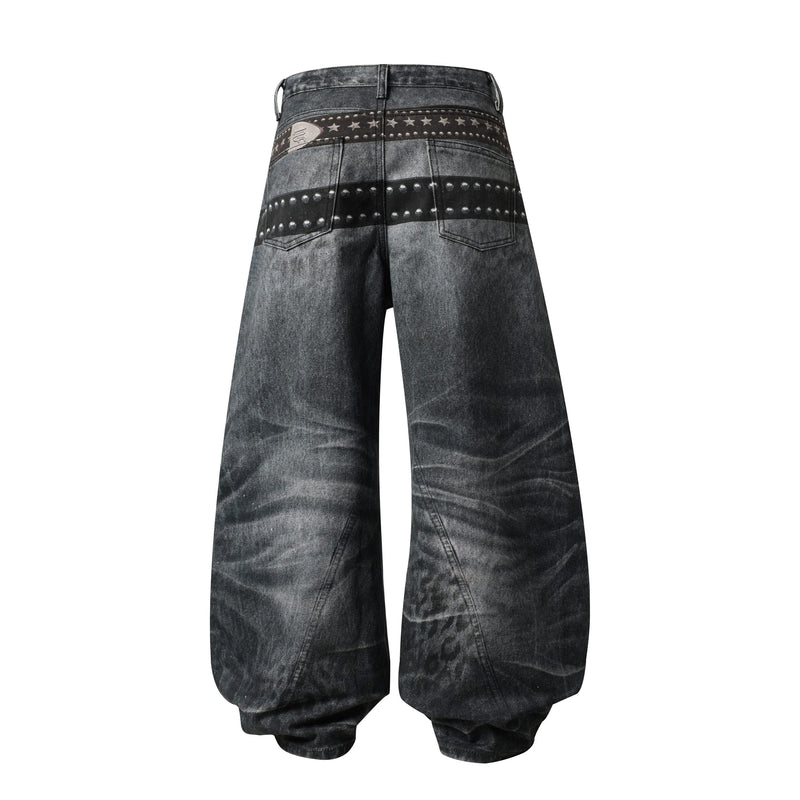 Back view of washed black wide-leg jeans with star-studded belt print and back pockets
