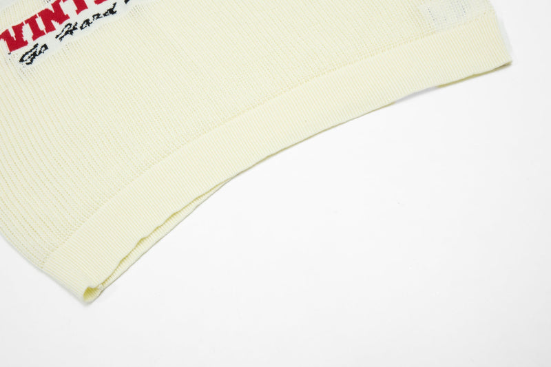 Cream knit varsity polo shirt with ribbed hem and collegiate red and black chest lettering