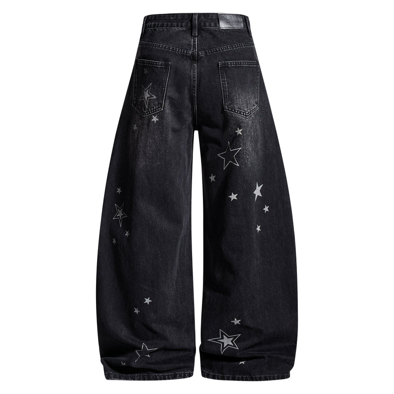 Back view of black washed barrel jeans with star print and rear patch pockets