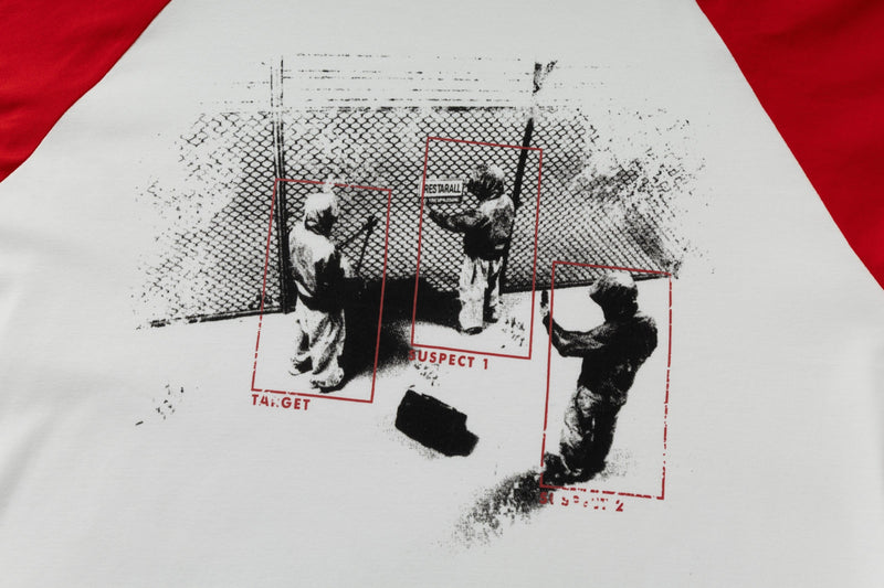 Close-up of front chest graphic on white raglan long-sleeve T-shirt