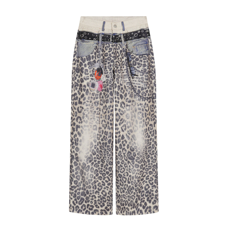Front view of wide-leg leopard print pants with patchwork denim waistband and hanging chain details