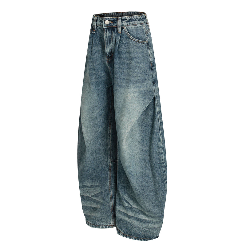 Front angled view of blue wide-leg jeans with faded wash and relaxed balloon legs