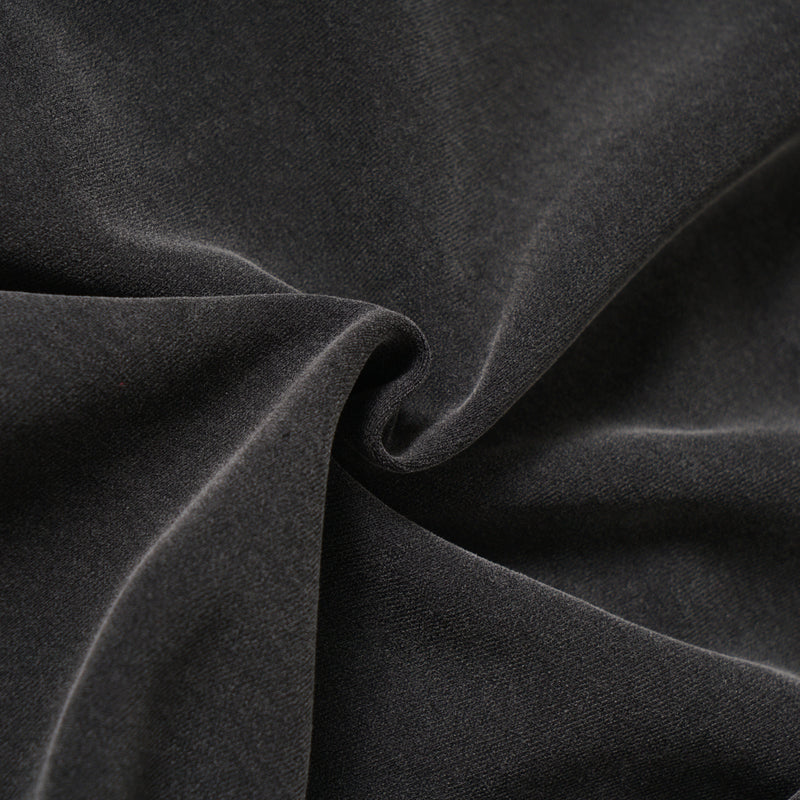 Close-up of black washed hoodie fabric folds and soft texture