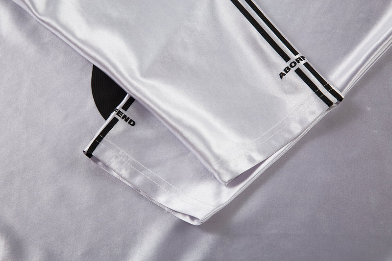 Folded white jersey sleeve cuffs with black stripe trim and ABORFEND print