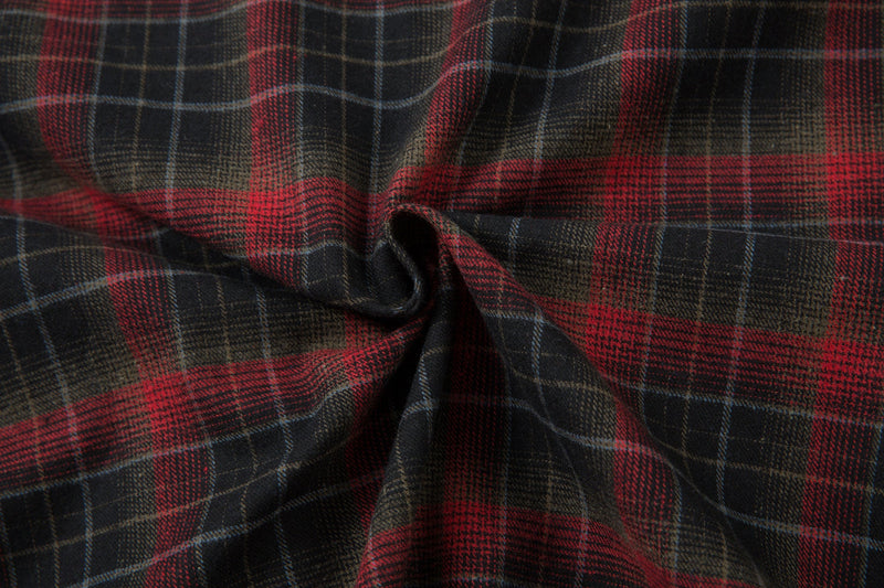 Close-up of the plaid flannel fabric gathered in a wrinkle detail