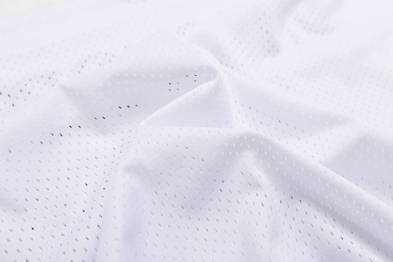 Close-up of white perforated mesh fabric for a varsity football jersey T-shirt, showing lightweight streetwear texture