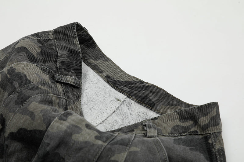 Inside waistband close-up showing white pocket lining and camo fabric detail