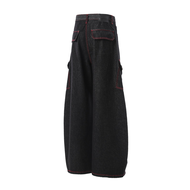 Rear side view of black cargo denim pants with red contrast stitching