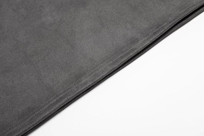 Close-up of dark gray mesh jersey hem with stitched edge and soft streetwear texture