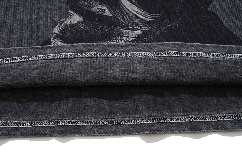 Vintage washed black gothic graphic T-shirt with raw hem stitching and faded distressed texture