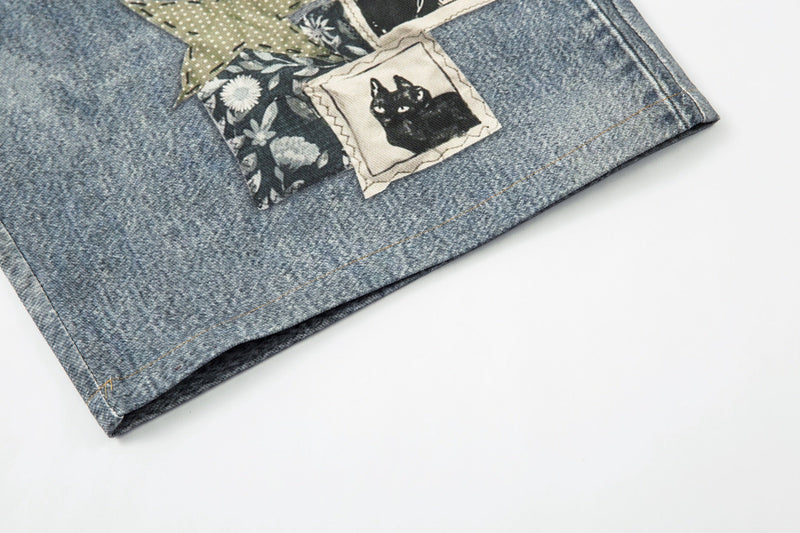 Bottom hem of light wash denim shorts with visible seam stitching