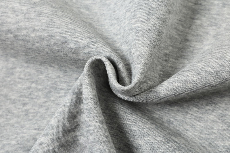 Close-up of gray sweatshirt fabric texture with soft folded drape