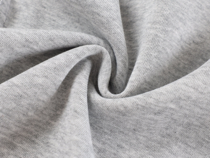 Close-up of light gray hoodie fabric texture and soft knit weave