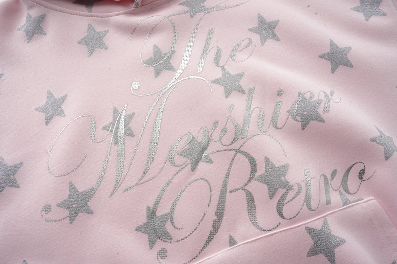 Pink star print sweatshirt front close-up with glitter script lettering
