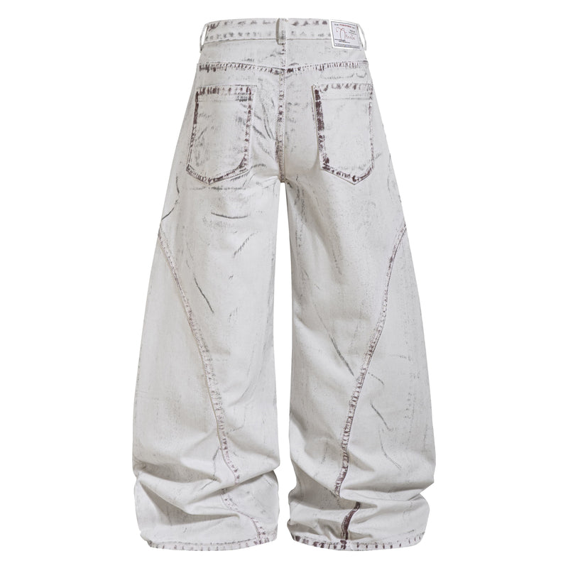 Back view of white washed wide-leg denim pants with patch pockets and logo label at waist