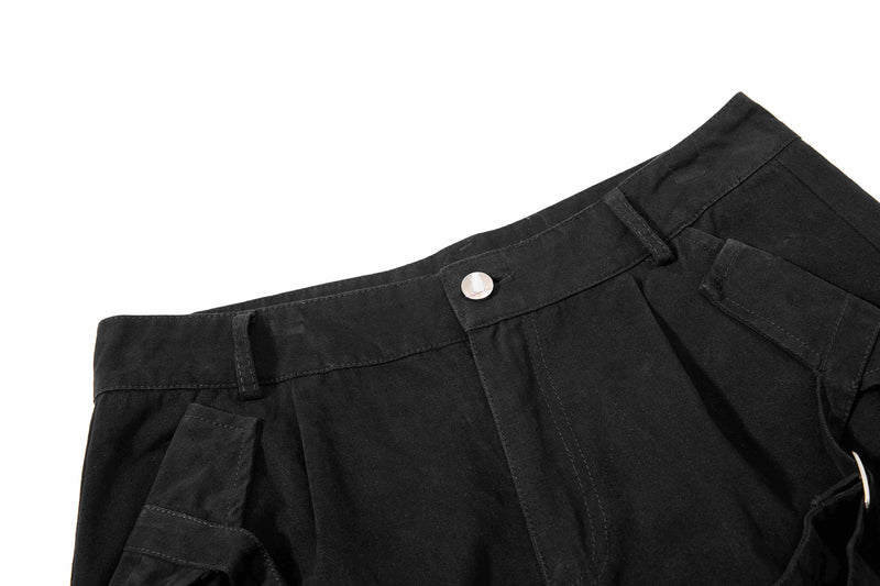 Black shorts waistband and front pocket detail with snap button