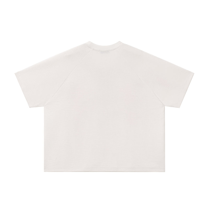 Off-white oversized tee with textured knit fabric and a relaxed crew neck silhouette on a clean white background