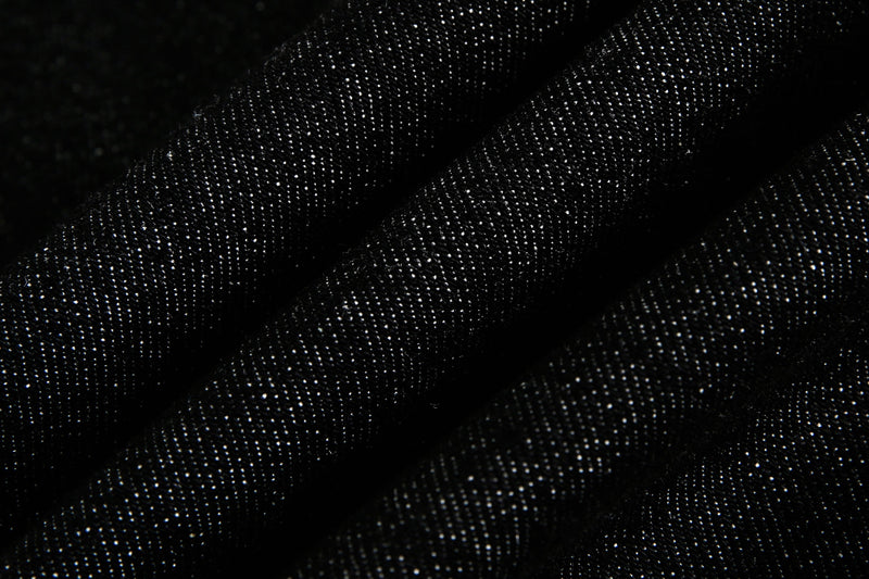 Extreme close-up of black denim fabric texture