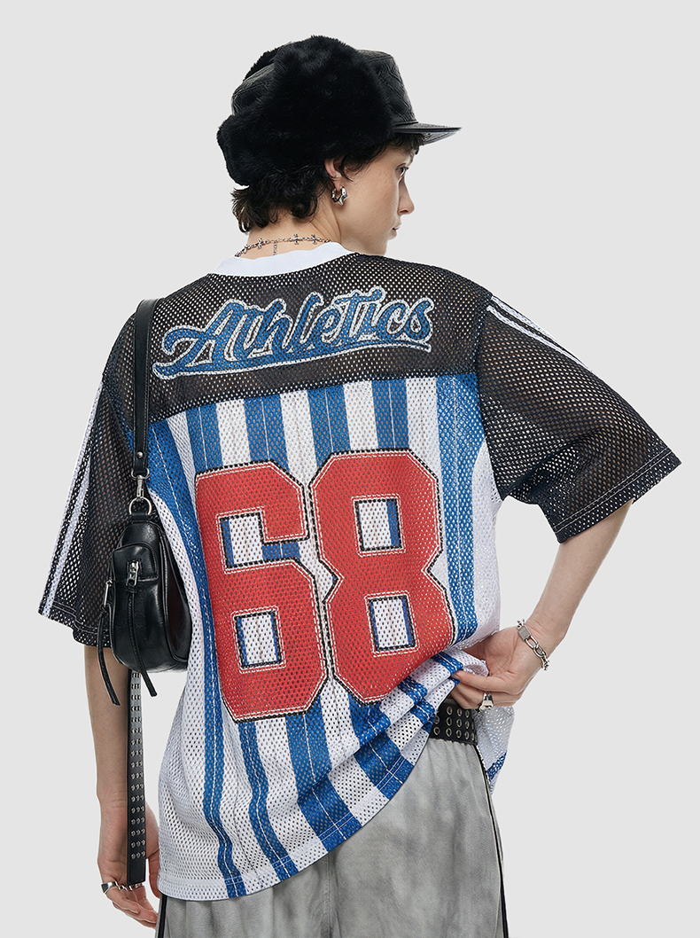 Back view of a black and white mesh jersey shirt with blue stripes, red 68 graphic, and Athletics lettering