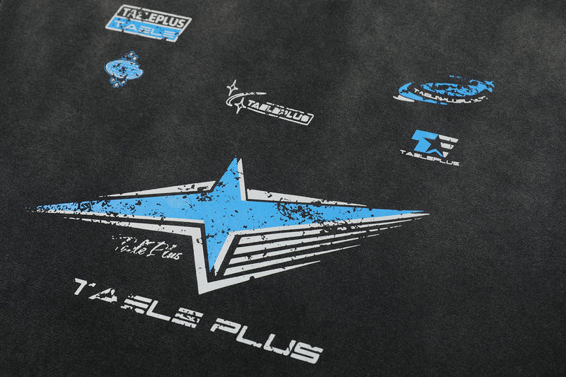 Close-up of black tee front graphic with blue star design and small logo prints