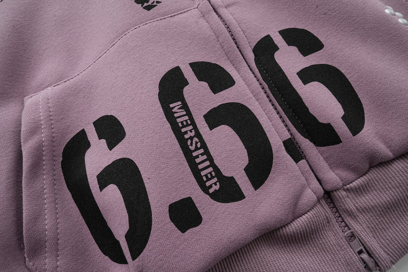 Close-up of lavender hoodie front pocket with large 666 print