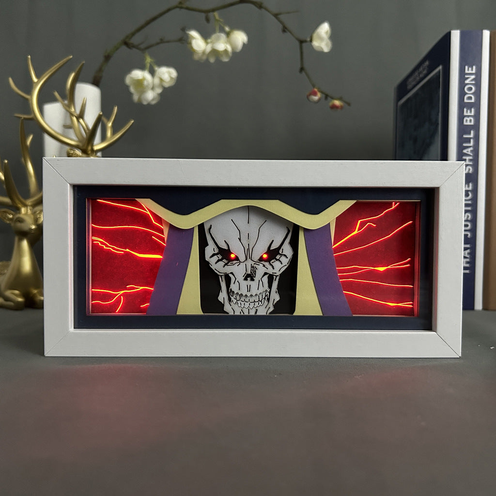 The Seakoff Overlord Anime Light Box features a 3D LED Lamp with dynamic color-changing effects, showcasing a skull with glowing red eyes, cracked features, and crimson lightning. It&