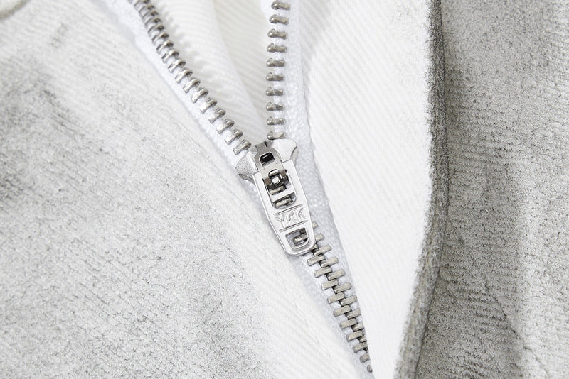 Close-up of light gray jeans zipper fly with white lining