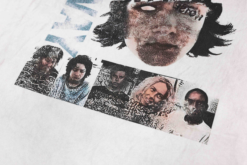 White vintage washed graphic tee featuring a collage of face portraits in a Y2K streetwear style