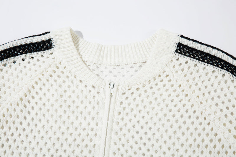 Close-up of white zip-up jacket front with ribbed collar and mesh knit