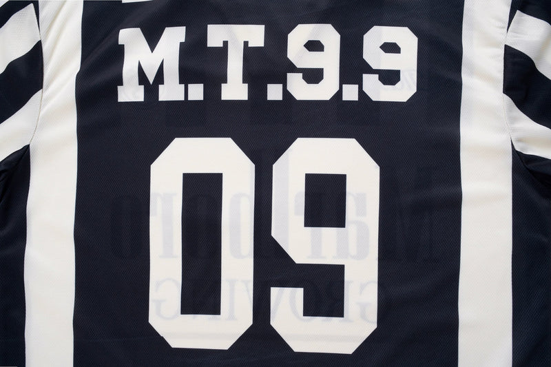 Black retro varsity soccer jersey with white striped sleeves and bold M.T.99 lettering on the back