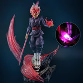 The Seakoff Goku Black Collectible Figure from Dragon Ball Super is a 38cm statue featuring pink-haired Goku Black, a fierce pose with a red object, and a large glowing pink energy sword. Dressed in dark attire and set on a rocky base, it&