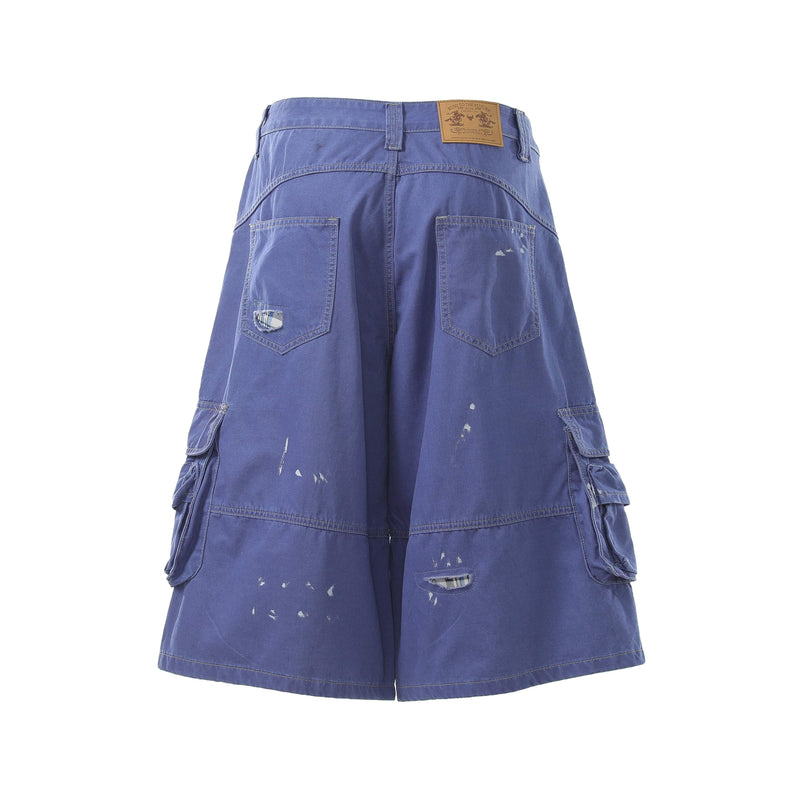 Blue cargo shorts back view with square patch pockets, leather label, and distressed marks