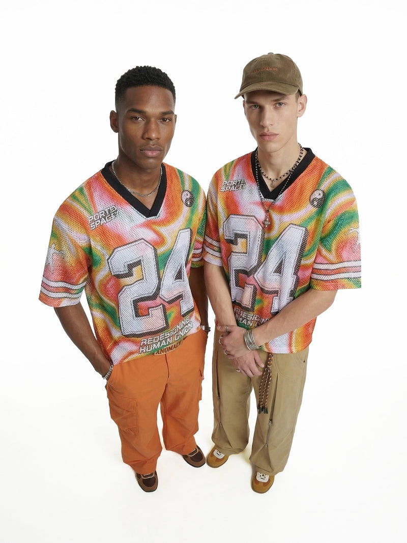 Two models wearing oversized multicolor gradient mesh jersey T-shirts with bold 24 graphics and black V-neck trim