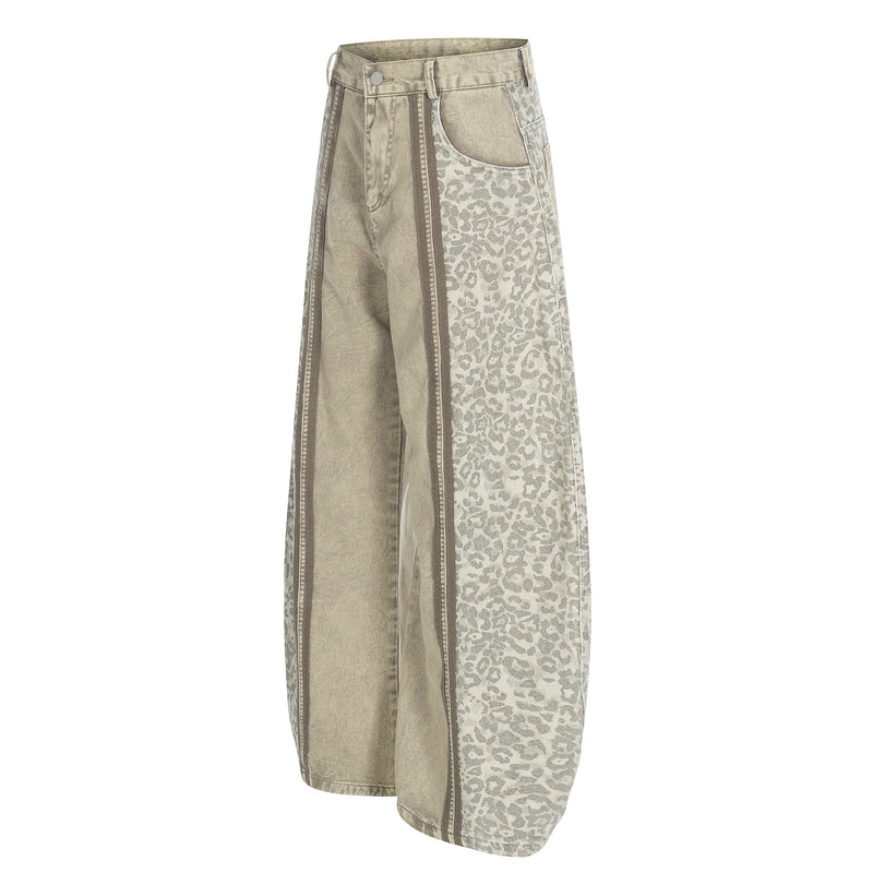 Beige denim wide-leg pants with leopard side panels, angled front view