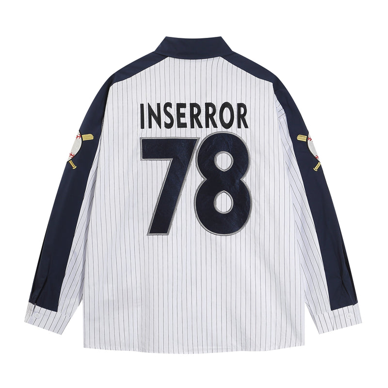 Back view of a navy and white pinstripe baseball shirt with Inserror 78 lettering and side baseball patches