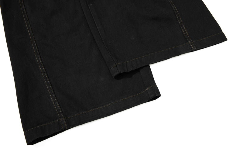 Close-up of black wide-leg hem with stitched cuff detail
