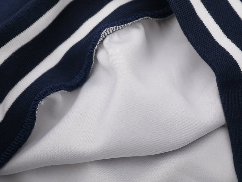 Close-up of white lining and navy striped cuff seam inside sleeve