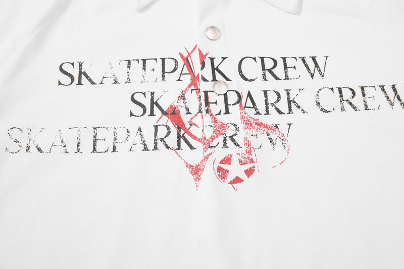White distressed polo shirt with Seakoff Skatepark Crew graphic in black and red across the chest