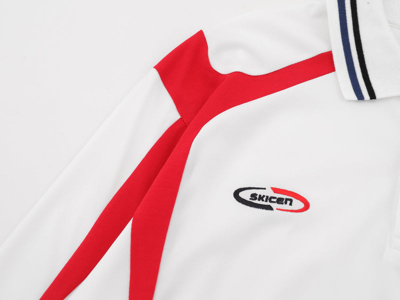 Close-up of white and red shoulder panel with logo and striped collar detail