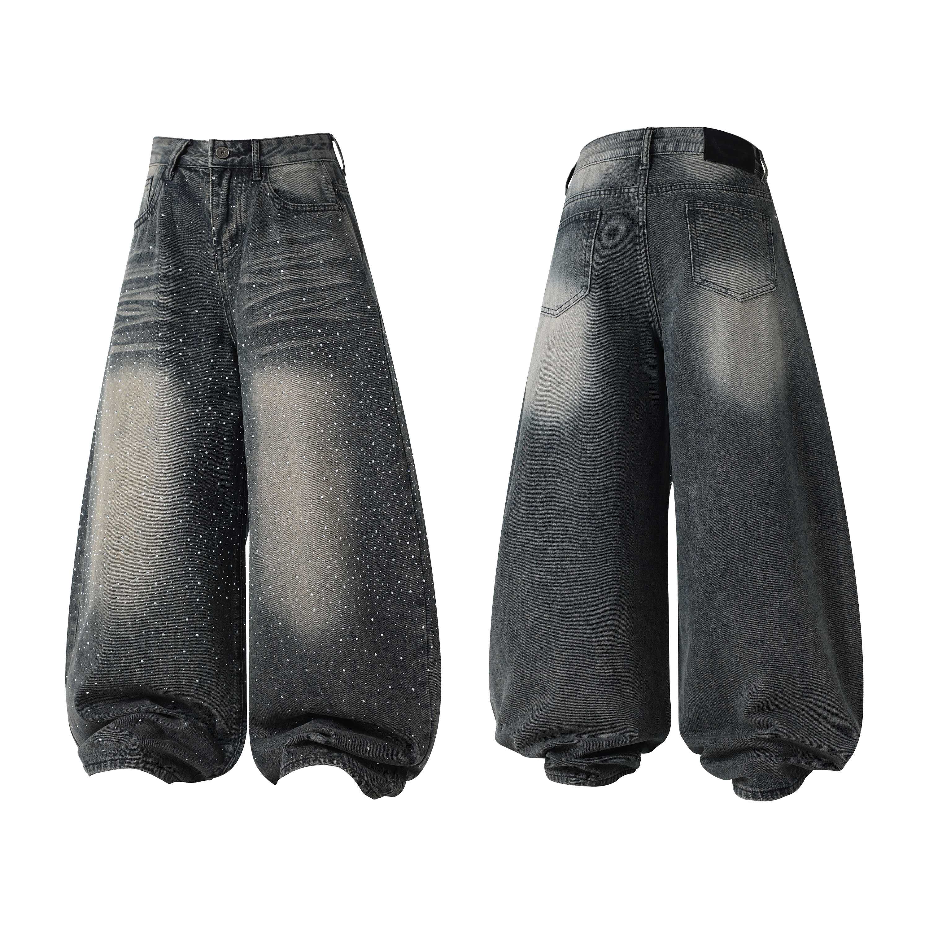 Front view of wide-leg grey washed denim jeans with all-over speckle detailing and stacked hem