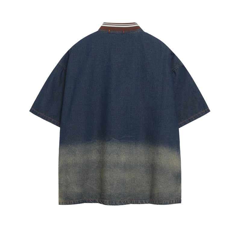 Oversized denim jersey tee with faded wash, striped ribbed collar, and short sleeves in vintage streetwear style