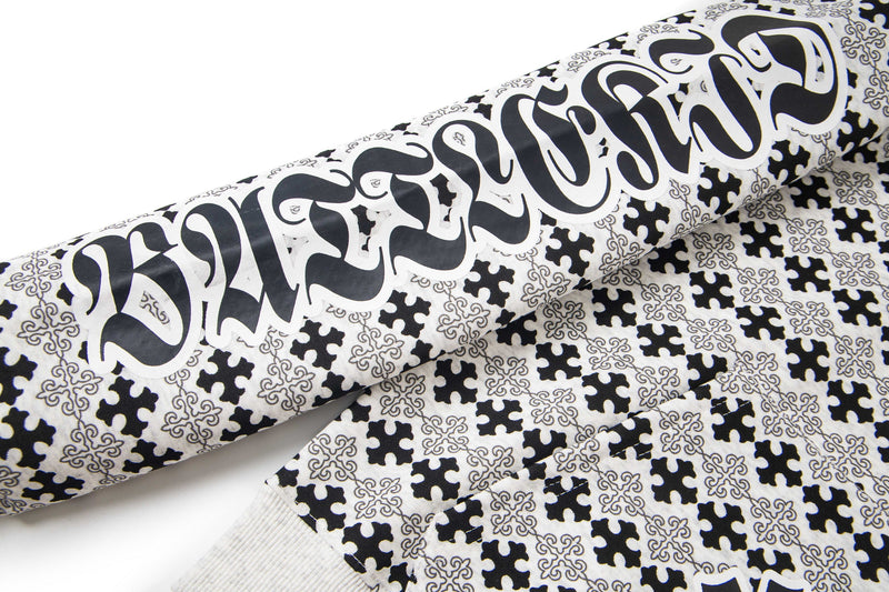 Side sleeve with gothic lettering on black and white hoodie
