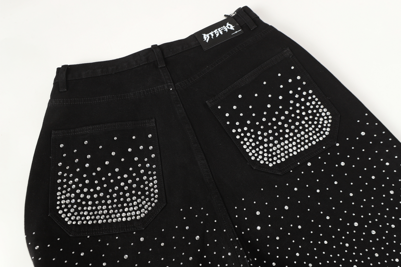 Back yoke and pockets on black rhinestone jeans, close-up