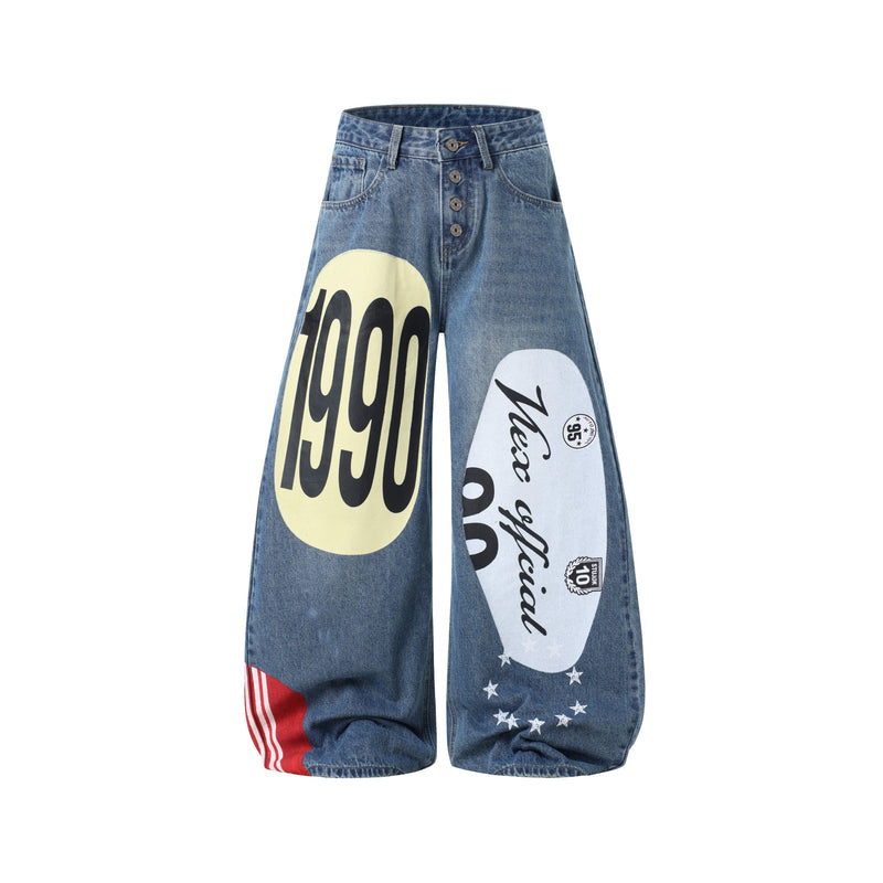 Blue wide-leg jeans front view with large retro graphic prints and button fly