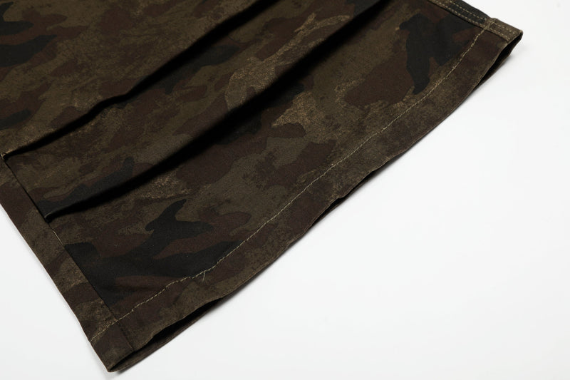 Close-up of hem on camouflage cargo shorts with wide leg opening